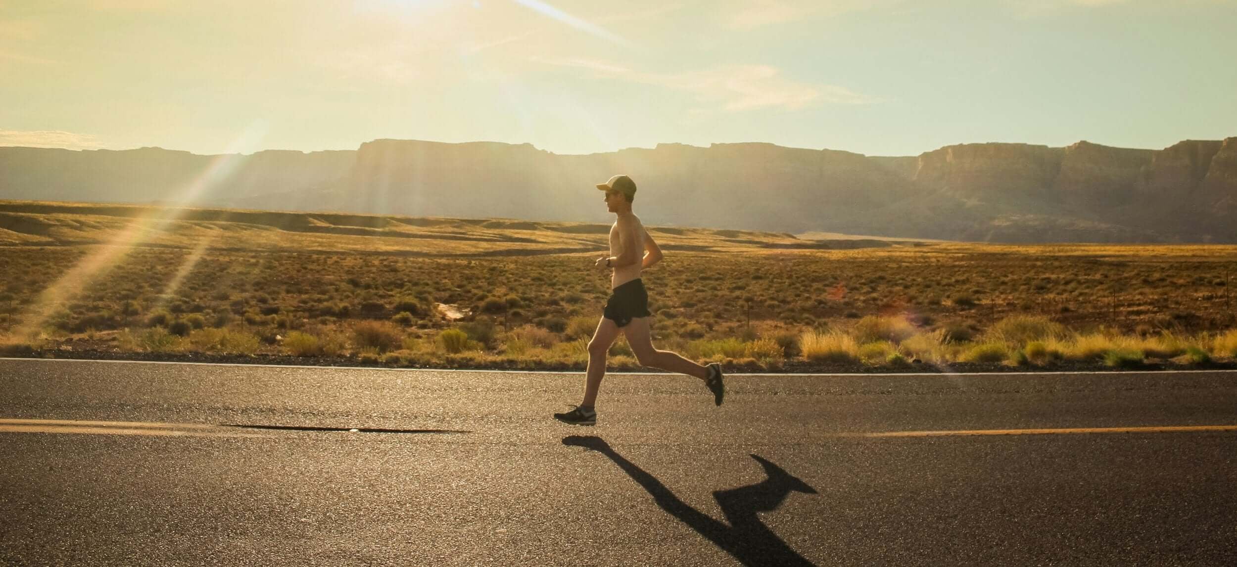 Man running along the road